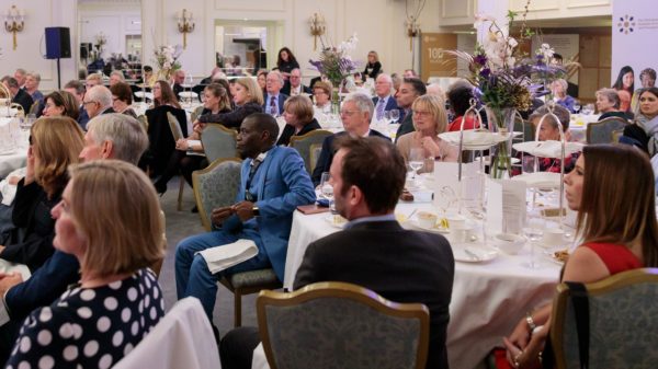 Guests listen to proceedings