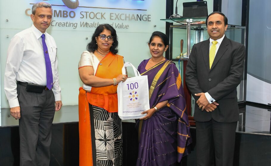 Gayani de Alwis giving gifts to members of the Colombo stock exchange during a visit